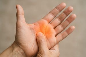 a person massaging his hand