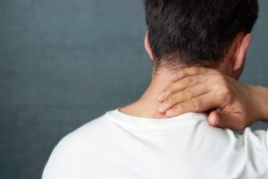 a man massaging his neck