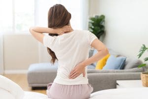a picture of a woman experiencing back pain